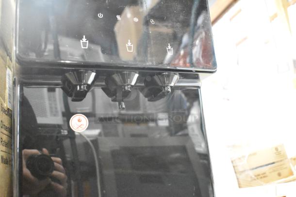 Avalon A5BLK self-cleaning bottleless water cooler in black, showing control panel and dispenser taps. Brand new, minor dents.