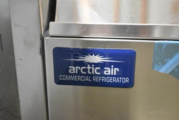 BRAND NEW Arctic Air ACP63 prep station. 63" refrigerated, 115V, 1 Phase. Scratch and dent, commercial refrigerator label visible.