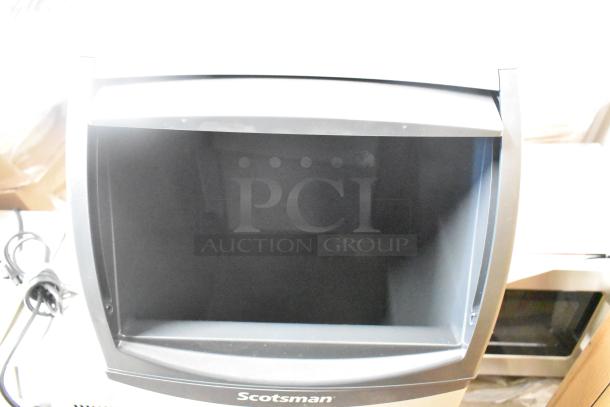 Brand new Scotsman UN0815AX-1A undercounter nugget ice machine, 36 lb. bin, 115 volts, 1 phase, slight scratches visible.