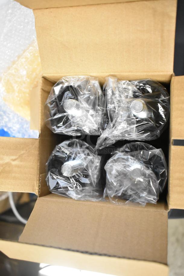 Box with packaged components of Scotsman UN0815AX-1A Nugget Ice Machine. Items are new, wrapped in plastic.