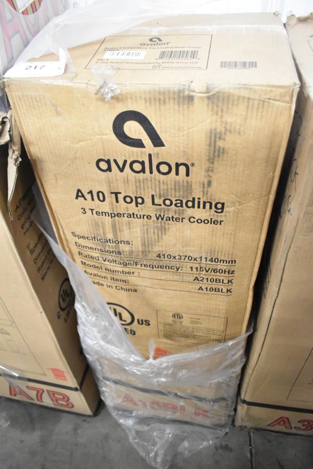 Avalon A10BLK and A3F water coolers in original packaging. Boxes show minor wear; both offer hot and cold water options.