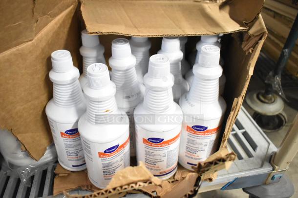 Box of Diversey Crew Heavy Duty Toilet Bowl Cleaner bottles. Bottles are in an open, damaged cardboard box.