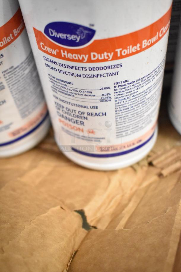 Auction lot featuring Diversey Crew Heavy Duty Toilet Bowl Cleaner, detailed label with disinfecting claims.