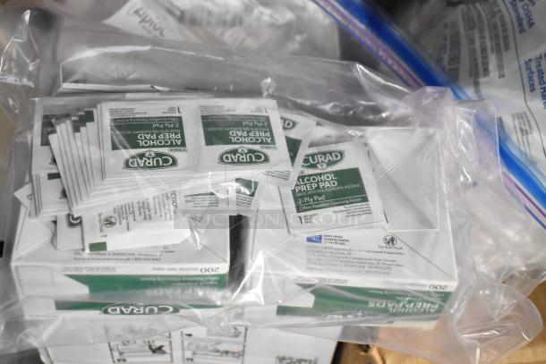 Bag of Curad Alcohol Prep Pads, in packaging. Part of a lot with Diversey toilet bowl and Biotech surface cleaners.