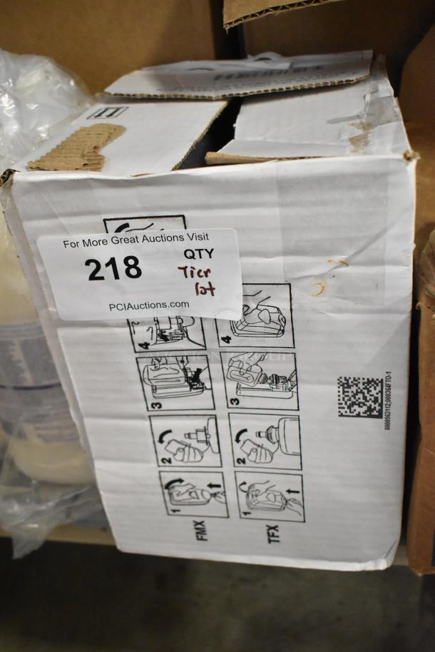 Box labeled "218 Tier Lot" containing Diversey toilet bowl cleaner, Biotech multi-surface cleaner, Curad alcohol pads.