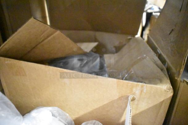 Cardboard box containing Diversey Crew Toilet Bowl Cleaner, Biotech Multi Surface Cleaner, Curad Alcohol Pads for auction.