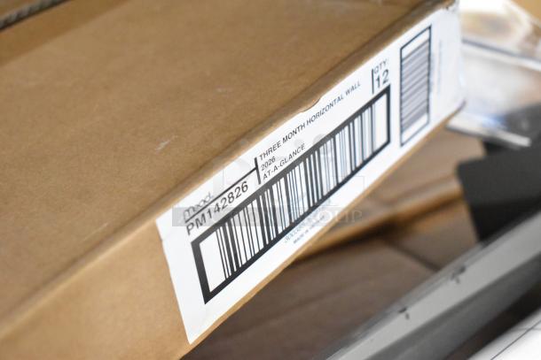 Box labeled "Mead PM142826 Three Month Horizontal Wall, 2026, At-A-Glance," part of a diverse auction lot.