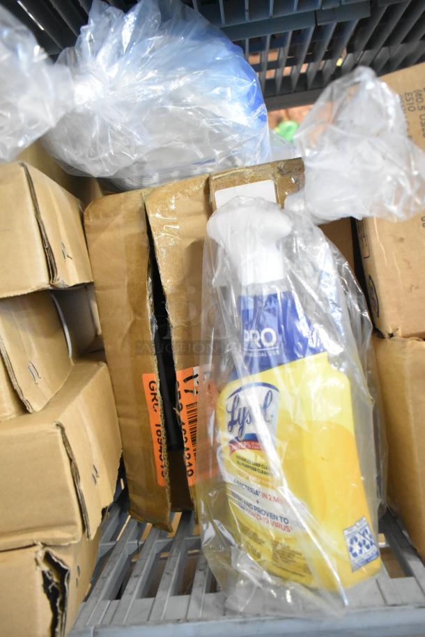 Two-tier lot featuring Lysol Cleaner, boxed items, and products in plastic, including soap and cleaning supplies.