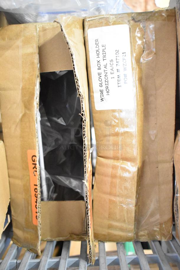 Two-tier lot with various items: desk calendars, Lysol cleaner, wire glove box holder, and antibacterial soaps. Box labels visible.