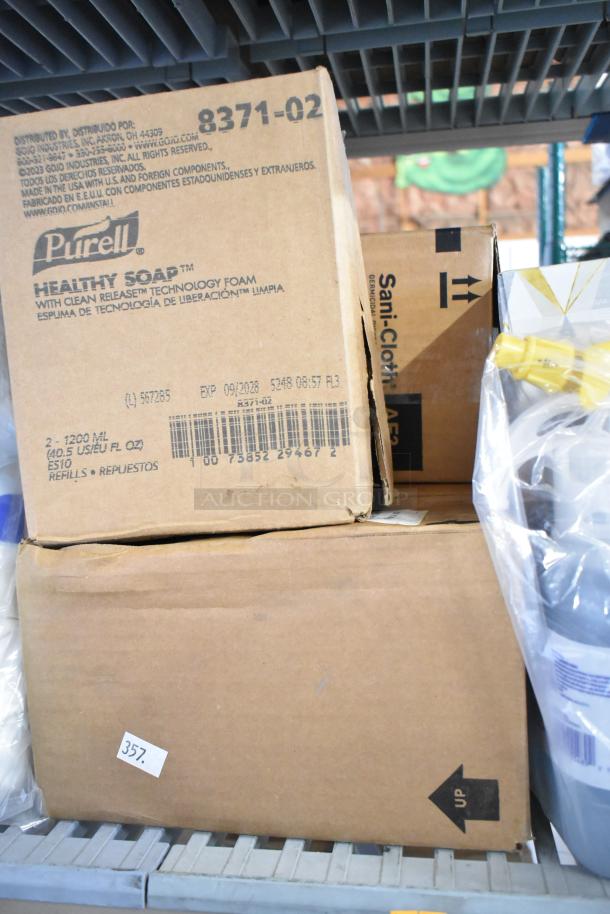 Two-tier lot with Purell Healthy Soap boxes, Sani-Cloth, Lysol Cleaner, wire glove box holder, and desk calendars.