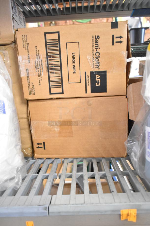 Two-tier shelf with items like Sani-Cloth boxes labeled "Large Wipe," Lysol cleaner, and Purell Healthy Soap visible.