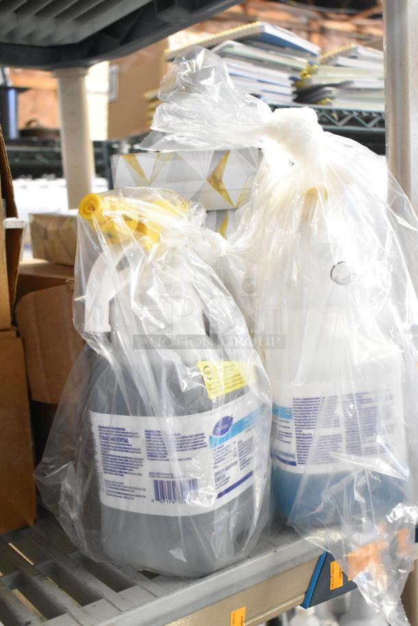 Two-tier lot with various items: desk calendars, Lysol cleaner, wire glove box holder, Purell soap, Coastwide foaming soap.