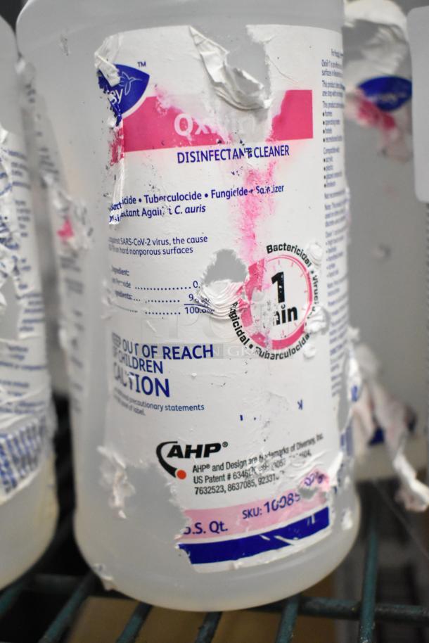 Two-tier lot including Betco AF79 cleaner, Coastwide disinfectant, Purell hand sanitizer, Briotech sanitizer. Torn labels evident.