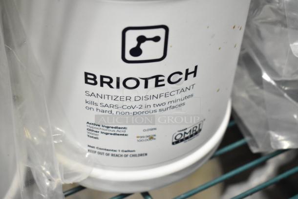 Two-tier lot featuring Briotech Sanitizer, Betco AF79 Cleaner, Coastwide Disinfectant, Purell Foam; 1-gallon sanitizer label visible.