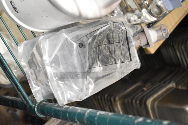 Two tier lot with Betco AF79 Cleaner, Coastwide Disinfectant, Purell Hand Sanitizer Foam, Briotech Sanitizer, various items.