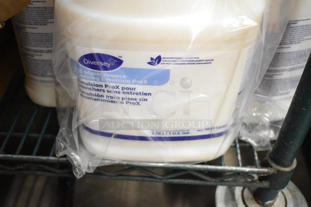 Two-tier lot with Diversey floor cleaner, 3.78L jug. Includes Betco AF79, Coastwide disinfectant, Purell sanitizer, Briotech sanitizer.