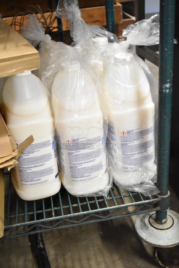 Two-tier shelf with Betco AF79 Cleaner bottles, Coastwide Disinfectant, and Briotech Sanitizer in plastic wrap.