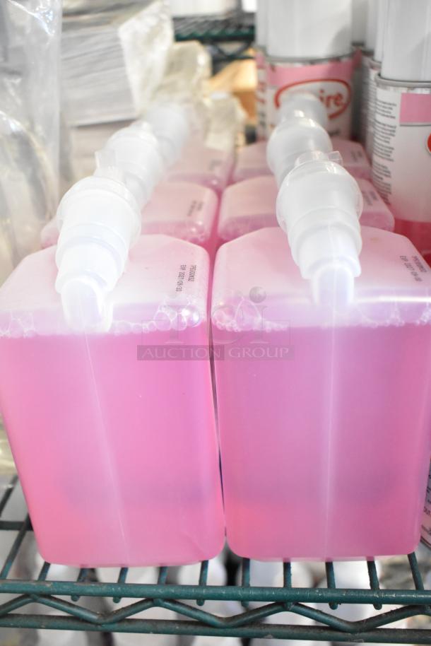 Two tier lot with 1099 envelopes, pink hand sanitizer bottles, Scott foam skin cleanser, Claire disinfectant spray.