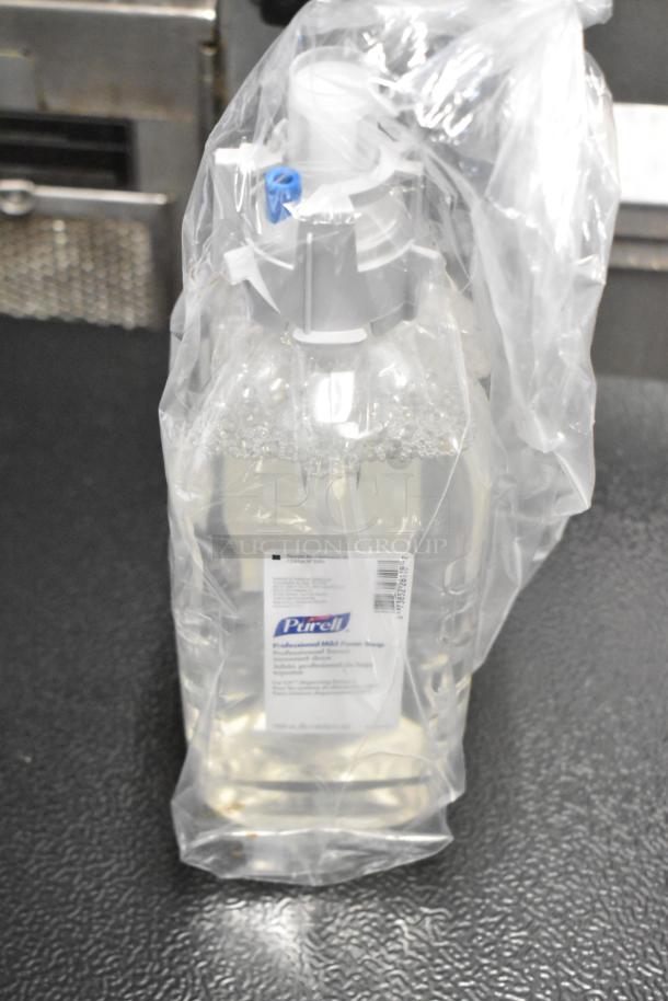 Clear Purell Professional Mild Foam Soap in sealed packaging, visible label with product details, part of a two-tier lot with various items.