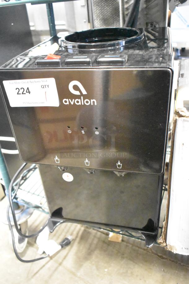 Avalon A11BLK top loading countertop water cooler, black, 115 volts, 1 phase, features hot/cold taps, new condition.