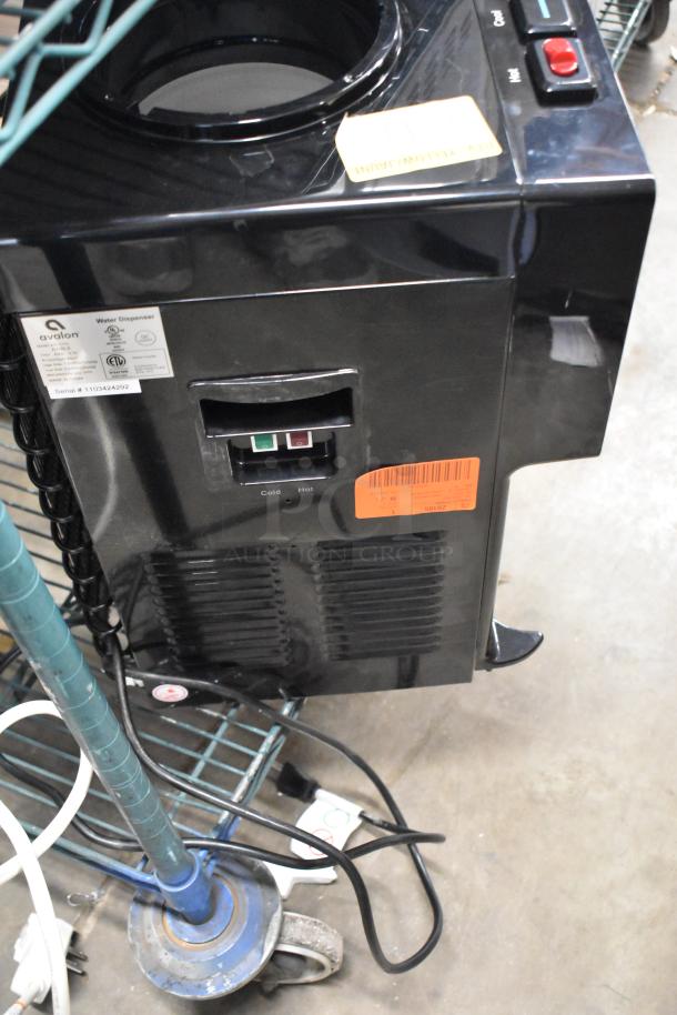 Avalon A11BLK countertop water cooler, top loading, 115 volts, features hot and cold dispensing, black finish, visible labels.