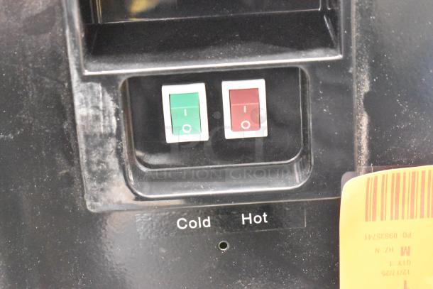 Avalon A11BLK countertop water cooler controls, featuring switches for hot and cold water. Visible wear on the panel.