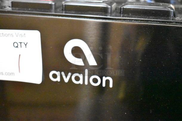 Avalon A11BLK countertop water cooler, top loading, 115V, 1 phase. Black finish, visible logo and quantity sticker.