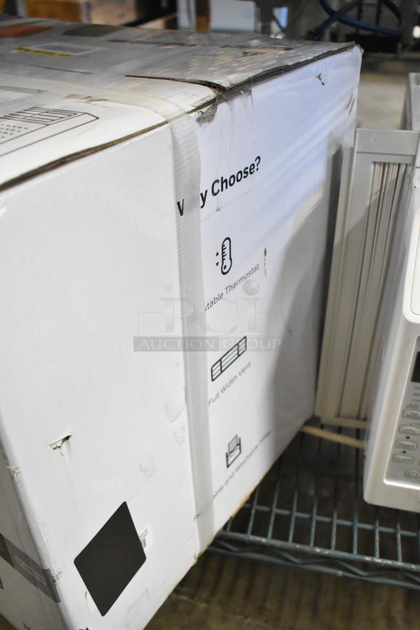 Brand new yet slightly dented Honeywell HAC5 5,000 BTU window air conditioner in unopened box, showing minor box damage.