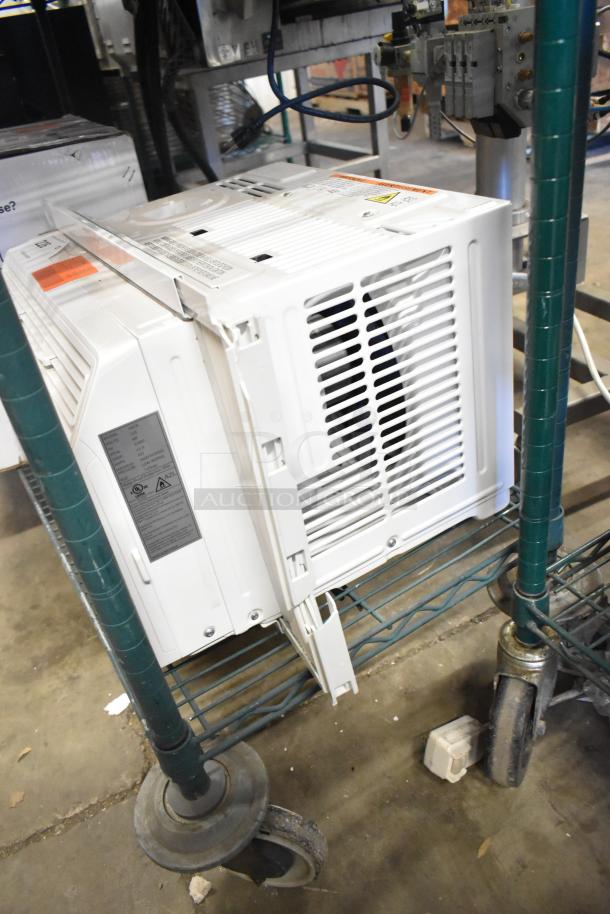 BRAND NEW Honeywell HAC6 6,000 BTU window AC unit, 115V, showing minor dents. Includes labels for specifications.
