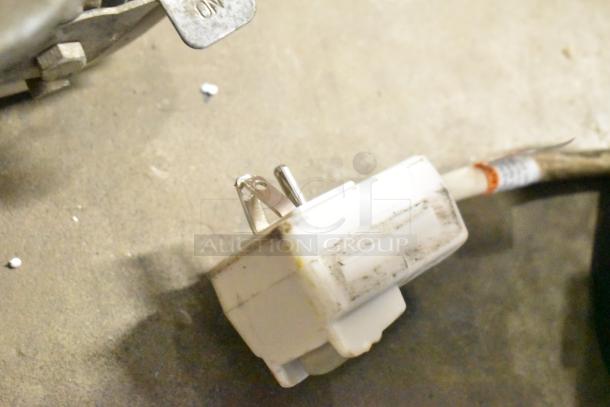 Closeup of plug for Honeywell HAC6 6,000 BTU window air conditioner, showcasing scratches and minor dents.