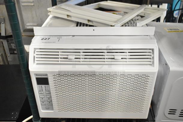 BRAND NEW Honeywell HAC6 6,000 BTU window AC, scratch and dent. 115 Volts, 1 Phase, visible controls, installation kit included.