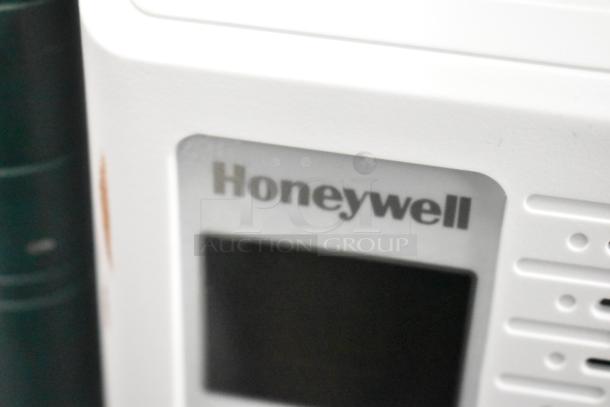 BRAND NEW Honeywell HAC6 6,000 BTU window air conditioner, 115V, 1 phase. Scratch and dent, visible Honeywell logo, pristine condition.