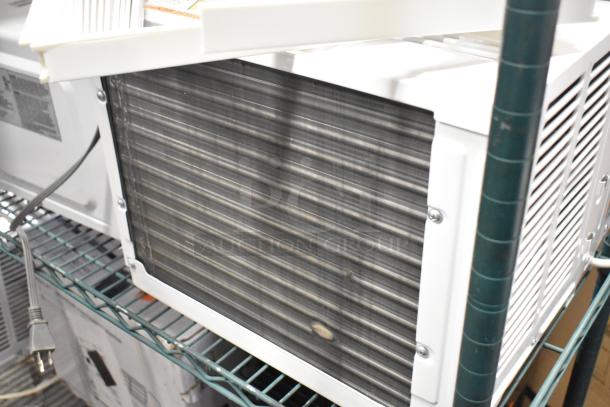 BRAND NEW Honeywell HAC6 6,000 BTU window AC, 115V, 1 phase. Visible scratch and dent. Image shows back and side vents.