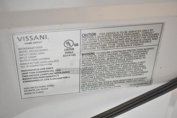 BRAND NEW Vissani EM720C2KHWCL 0.7 cu. ft. 700-Watt microwave info label, shows model, voltage, and safety warnings.