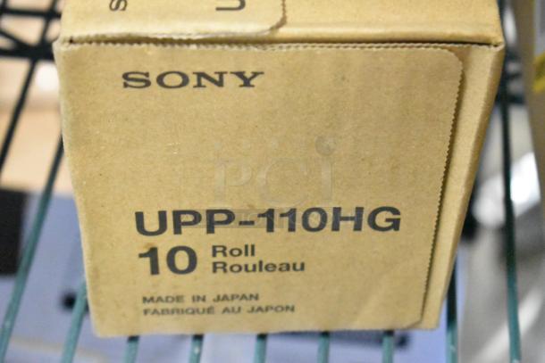 Box of Sony UPP-110HG rolls, labeled "10 Roll Rouleau," made in Japan, part of a 6-item scratch and dent auction lot.
