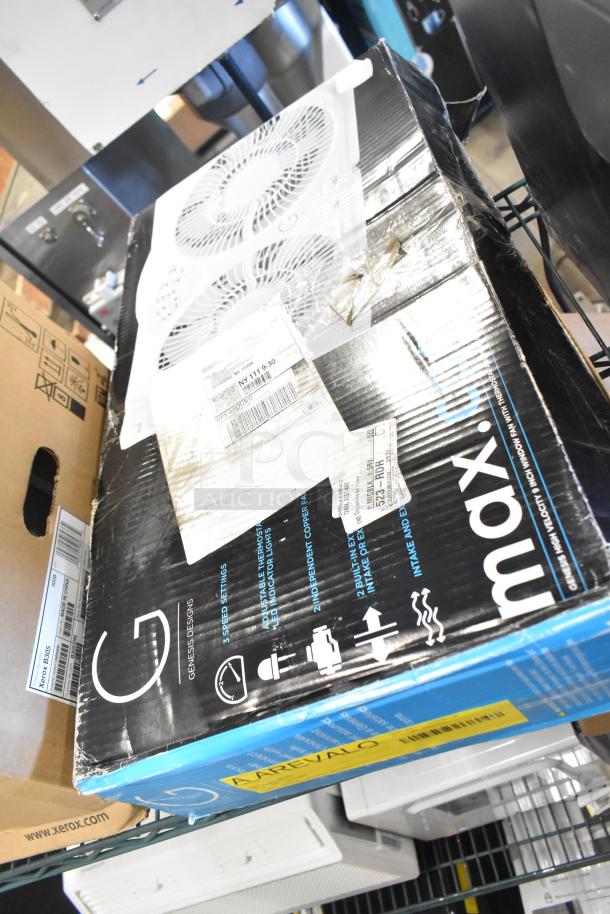 Boxed Genesis Twin Fan and Clip Fan, brand new. Some packaging minor dents, labels with specs and shipping info visible.