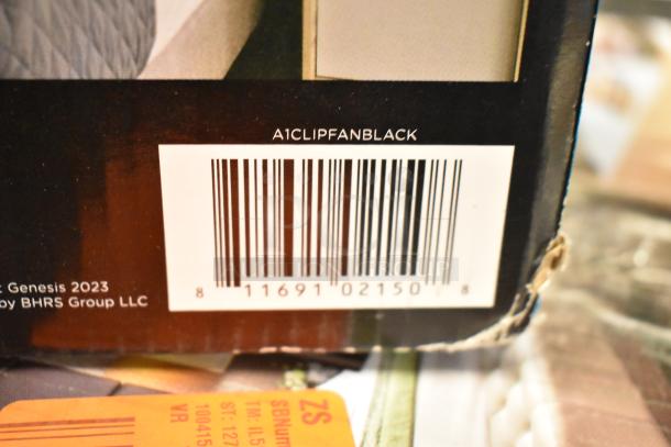Barcode with label "A1CLIPFANBLACK" on a Genesis fan package. Scratched corner visible.