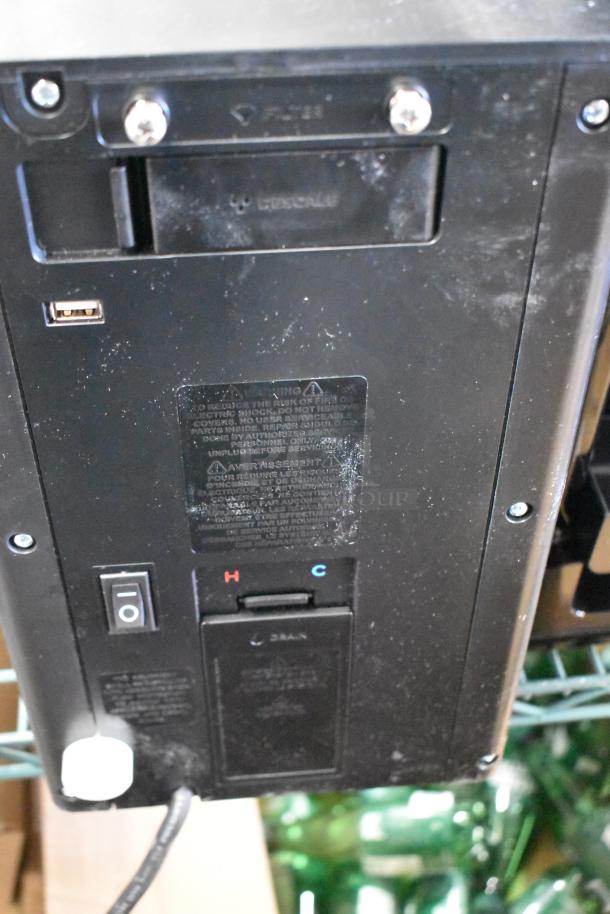 Keurig K-2550 Single Cup Coffee Machine, 115 Volts, used condition, back view showing power switch and label details.