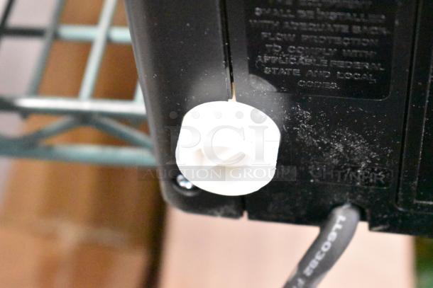 Keurig K-2550 single cup coffee machine rear view, showing power connection and label details. 115V, 1 phase.