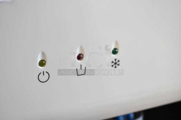 Avalon A1CTWTRCLRWHT water cooler control panel showing power, hot, and cold indicators.