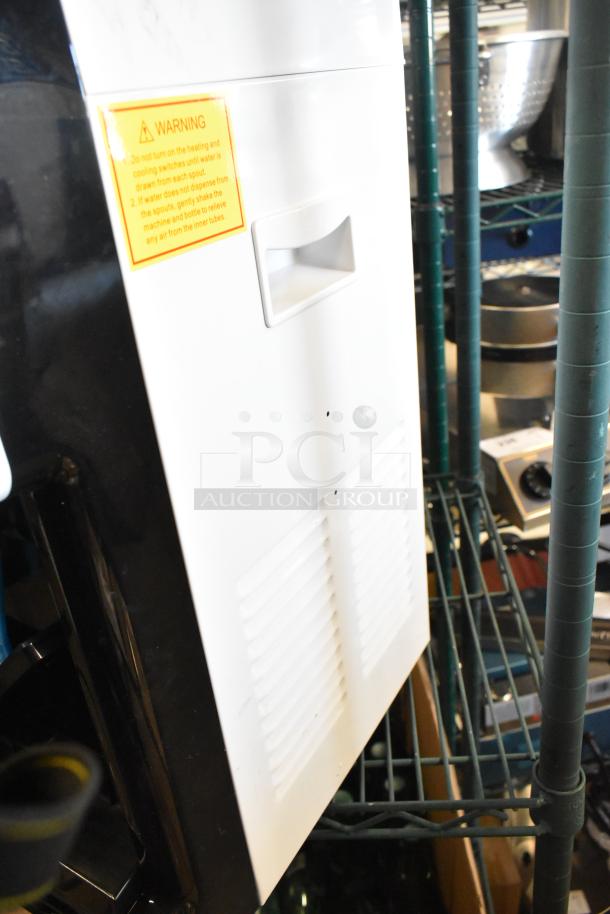 BRAND NEW Avalon A1CTWTRCLRWHT countertop water cooler, hot and cold, top loading, visible warning label, 115V, 1 Phase.