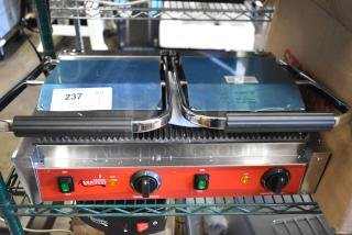 Brand new 2025 Avantco 177PG400 dual panini grill, grooved plates, 19 5/8" x 9 1/8" surface, 120V, minor scratches.