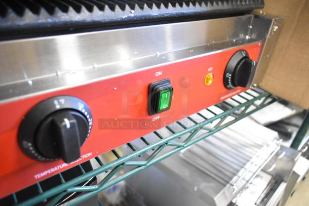 Brand new Avantco 177PG400 dual panini grill, grooved plates, 19 5/8"x9 1/8" surface, 120V, On/Off switch, temperature dial.