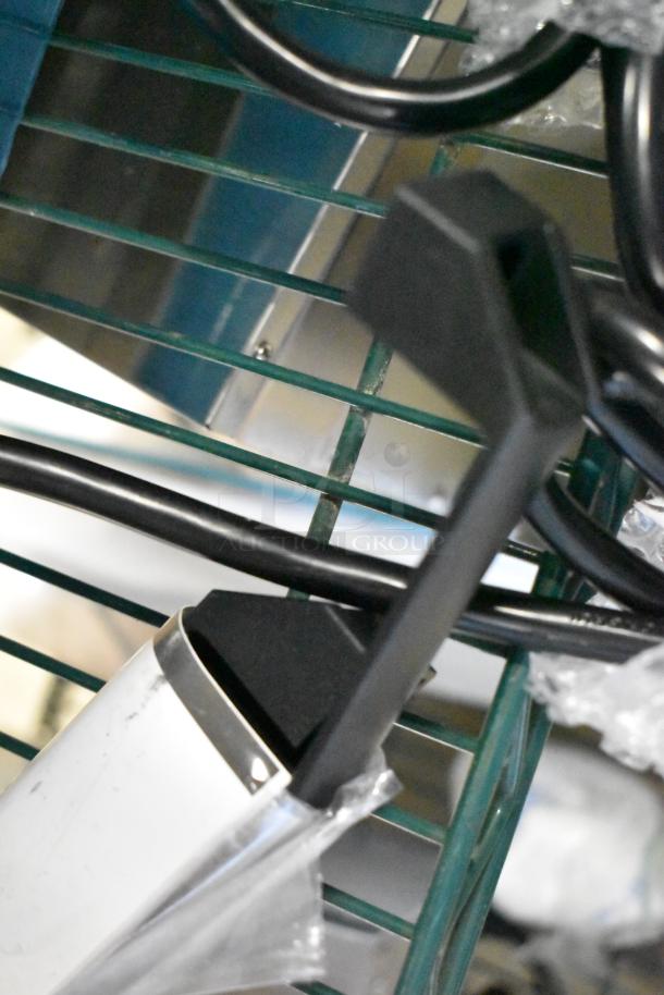 Brand new Avantco 177PG400 dual panini grill, 19 5/8"x9 1/8" grooved plates, 120V, 1 phase, slight cosmetic dent visible.