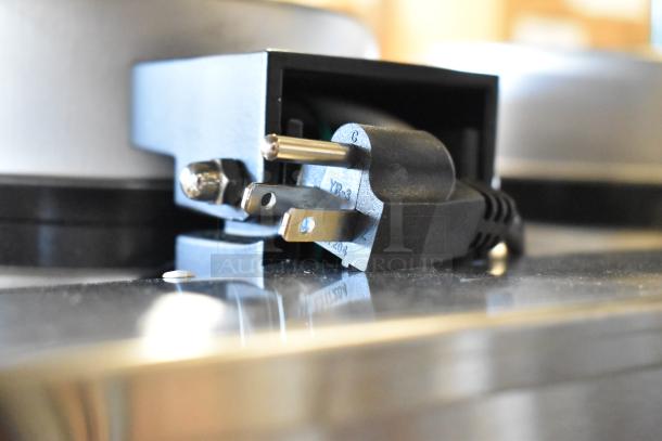 Plug and socket of the Carnival King 382WSM22 Double Waffle Maker featuring 120V connection.