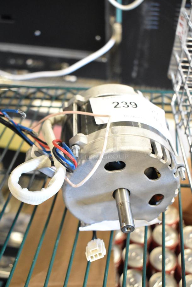 Brand new Avantco condenser fan motor for refrigeration equipment, model 17812245. Scratch and dent condition, tag number 239 visible.