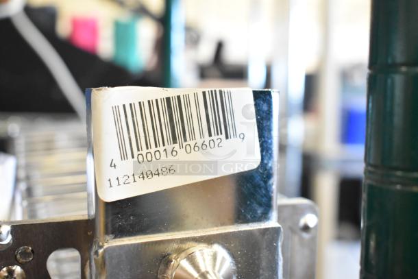 BRAND NEW SCRATCH AND DENT! 112140486 metal basket corner with barcode label showing item number and barcode details.