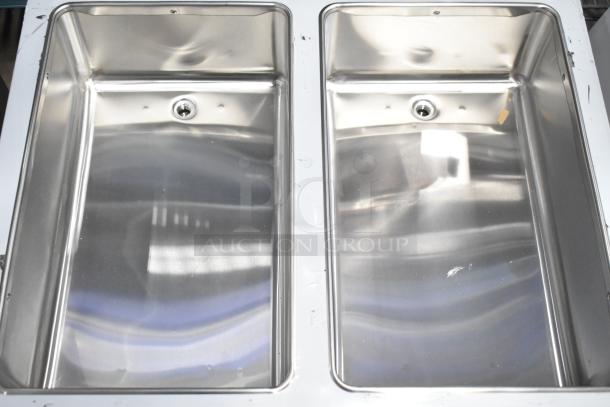 BRAND NEW ServIt 423EST2WSPB Electric Steam Table, two-pan, partially enclosed base, 120V, 1 Phase, scratch and dent condition.