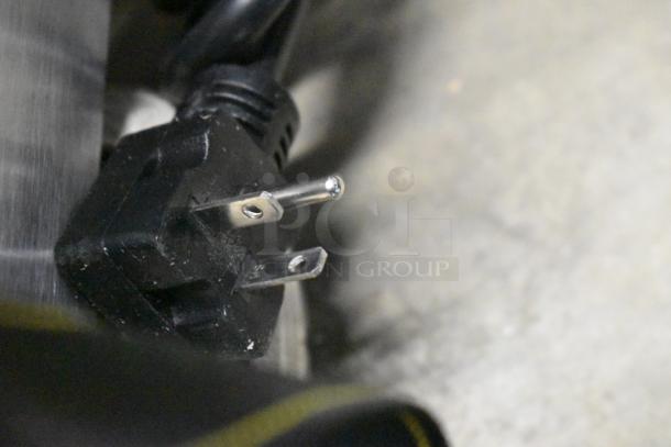 Close-up of a power plug for a Galaxy 177GCT10 conveyor toaster, showcasing prongs for 120 volts, 1 phase.