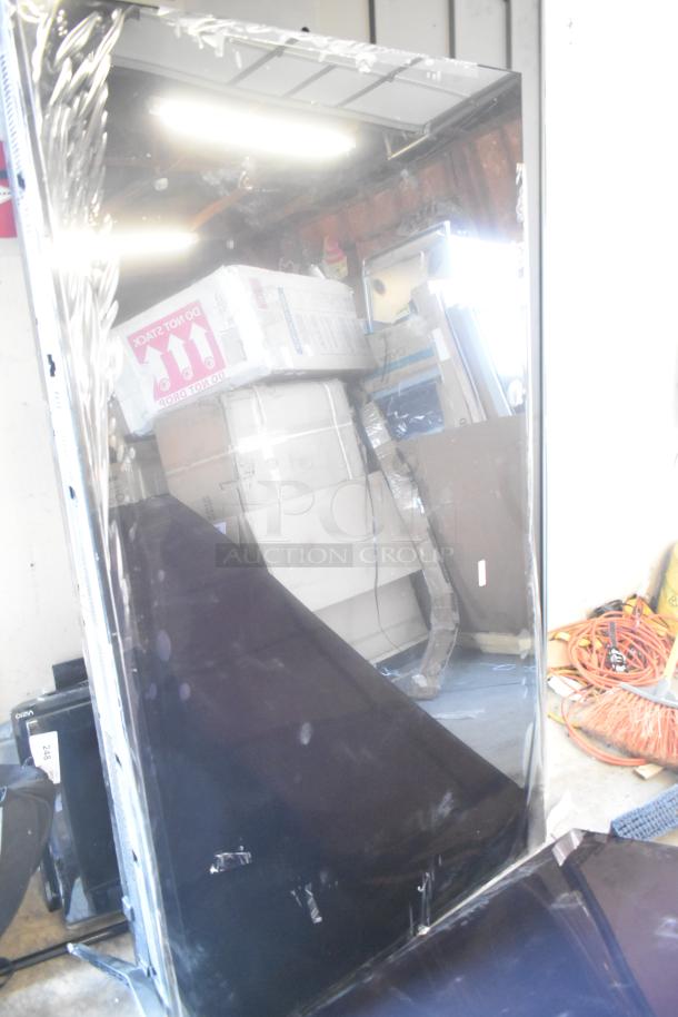 Four televisions including Samsung QN77S90FDF 77", Samsung UN75U7900FD 75", Vizio model. Buyer must pick up.